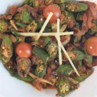 Bhindi (Okra) Masala (G), (V) · Stir-fried fresh okra infused with ginger in a thick base of sautéed tomatoes and onions.