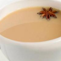 Masala Chai · Black leaves of Darjeeling Chai prepared with ginger, cardamom and Indian spices with milk.
