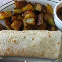 Gigante Breakfast Burrito · 2 eggs, ham, sausage, onions, bell peppers, avocado, tomato, cheese and salsa wrapped and se...