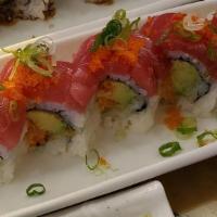 Clinton Roll · Rolled spicy shrimp with  avocado and tuna on top.