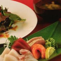 Sashimi Dinner · Three pieces of tuna, two pieces of yellowtail, salmon and halibut with Yuzu , garlic albaco...