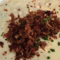 New England Clam Chowder · Red potatoes, clams, garnished with chives and bacon (GLUTEN FREE)