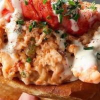 Lobster Grinder · Perfect combination of chilled lobster, shrimp and crab mixed in a spiced aioli, stuffed int...