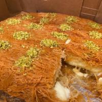 Knafeh Platter Filled With Ashta Cream · Medium Knafeh filled with Ashta sweet cream and syrup decorated with pistachios on the top.