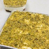 Aysh Al-Saraya / Ashta · rich ashta cream made with water rose, bottom with toasts on syrup topped with pistachios.