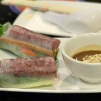 Grilled Pork Spring Roll · Grill pork, lettuce, mints and vermicelli noodles wrap in rice pepper.