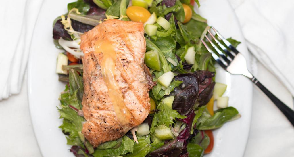 Grilled Salmon Salad · Mixed baby greens, Romaine lettuce and radicchio tossed with tomato, green apple, Dijon vinaigrette and garnished with lemon curd.