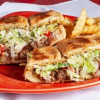 Toasted Mexican Roll · With guacamole, sour cream, mayo, lettuce, and beans tomatoes and choice of meat.