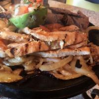 Cielo, Mar Y Tierra · Marinated chicken, shrimp, and beef grilled with fresh peppers, tomatoes, onions, and specia...