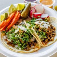 Tacos · Soft shell Taco with your choice of meat, topped with Onion, Cilantro and Salsa.