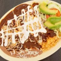 Enchiladas De Pollo Rojas O Verdes · Rolled tortillas stuffed with chicken, covered in your choice of spicy red or green sauce an...