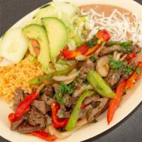 Fajitas De Res · Beef fajitas. Served with rice, beans, and salad.