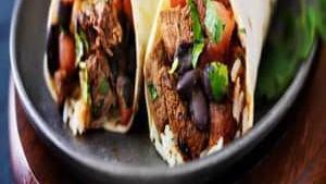 Burrito · Flour tortilla stuffed with the meat or vegetarian option of your choice, rice, beans, onion...