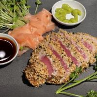 Seared Ahi Tuna Steak · Seared Tuna coated with sesame seeds served with garlic noodles.