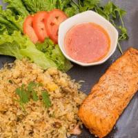 Grilled Salmon With Garlic Fried Rice · Grilled salmon filet with garlic fried rice, lettuce, shitake mushroom, and sweet and sour s...
