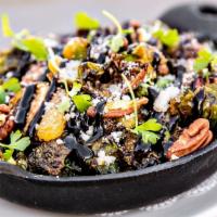 Cast Iron Roasted Brussels Sprouts With Crispy Kurobuta Pork Belly · garlic honey, apricot mostarda, candied pecans