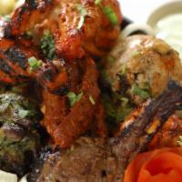 Tandoori Mixed Grill · Shrimp, chicken tikka, lamb boti kabab and tandoori chicken.