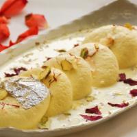 Rasmalai · Pistachio and cardamom flavored homemade milk balls. Served in sweet syrup.
