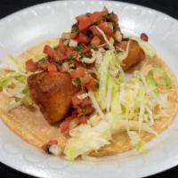 Fried Fish Taco · Lightly battered fish, cream sauce, cabbage and salsa mexicana