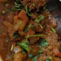 Lamb Vindaloo · Lamb cooked with ginger, garlic, cumin, vinegar and home made sauce with pieces of potato.