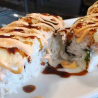 Baked Salmon · Crab, avocado, with salmon, dynamite sauce, spicy mayo and eel sauce.