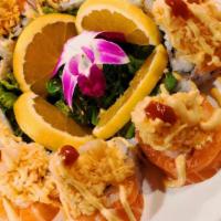 Orange Blossom · Inside shrimp tempura, avocado, crab , salmon, topped with spicy scallop crab mix and spicy ...