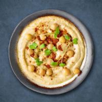 Hummus Appetizer Huba Huba · Garbanzo beans blended with fresh garlic, lemon juice, and tahini drizzled with extra virgin...
