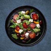 Greek Salad Getaway · A mix of lettuce, tomatoes, and onions topped with feta cheese, oregano and olives, with Gre...