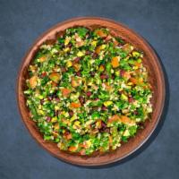 Parsley Tabouli Salad · Chopped parsley, tomatoes, onions, lemon juice, cracked wheat, and olive oil.
