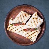 Big Beef Sandwich Wrap · Thinly carved marinated beef, parsley, onions, tomatoes, hummus, sumac, and tahini sauce. Se...