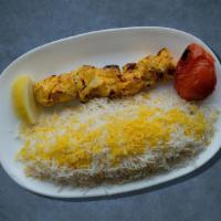 Chicken Kabob Dinner Plate · Two grilled chicken skewers, marinated in garlic and herbs. Served with rice, hummus, salad,...
