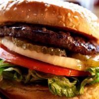 Hamburger (¼ Lb) · 1/4 pound fresh lean beef patty with special sauce, tomatoes, lettuce, onions, and pickles.