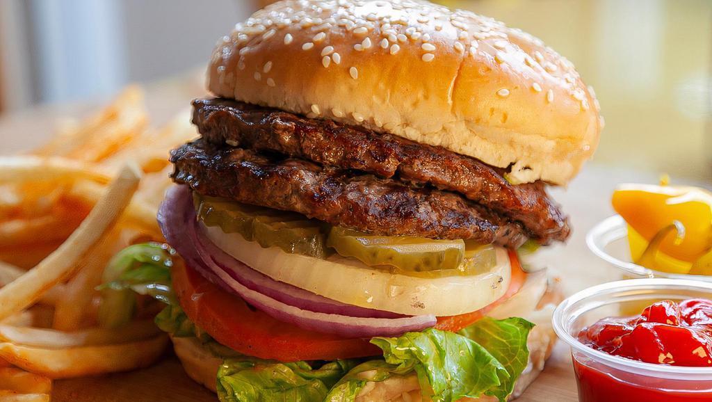 Double Burger (½ Lb) · Two 1/4 pound fresh lean beef patty with special sauce, tomatoes, lettuce, onions, and pickles.