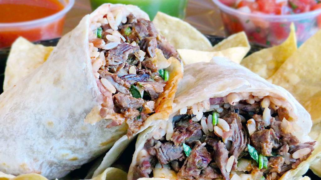 Burrito De Carne Asada · Lean charbroiled steak. Served with beans, rice, onions, cilantro, and salsa.