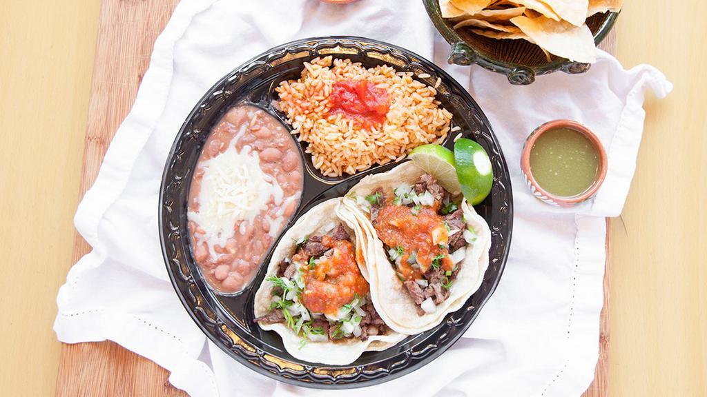 Taco Plate · Two tacos, meat or veggie and two side orders.