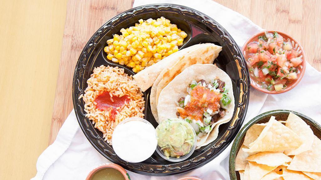 Fiesta Plate · One meat taco, one taquito de pollo, one mini cheese quesadilla, sour cream, guacamole and two side orders.