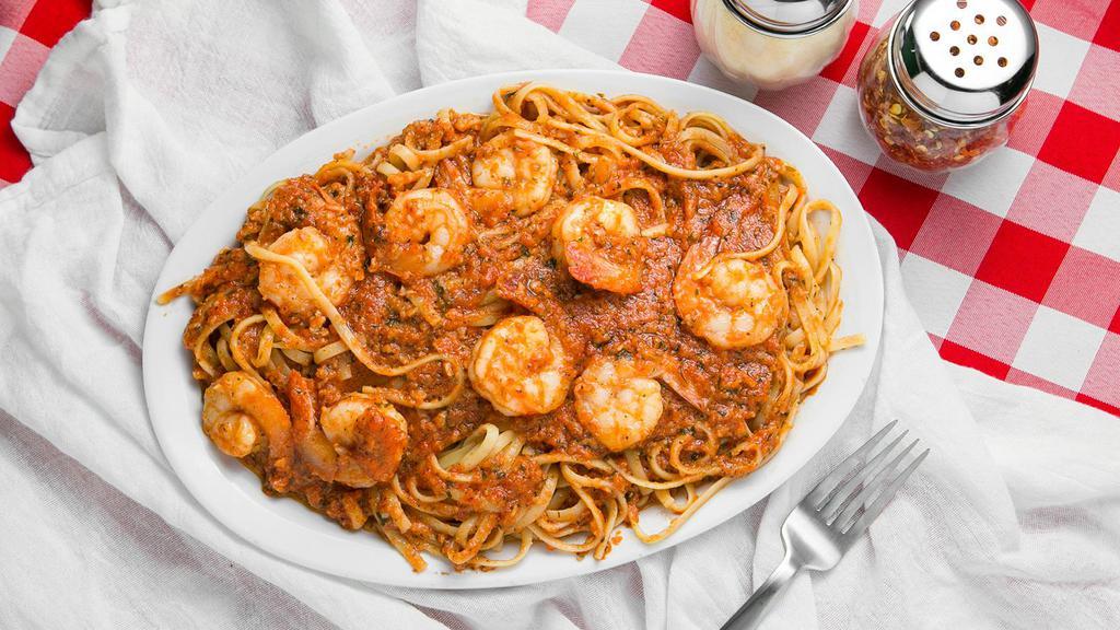 Shrimp Fra Diablo Over Linguini · Large Dish of Garlic, Butter and Spices sauteed with wine, red sauce, chili peppers and 8 Shrimp served over Linguini.  Very Spicy.