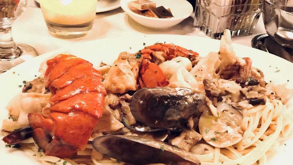 Linguini Frutti Di Mare · Lobster, shrimp, clams, mussels, calamari and fish sautéed in wine, garlic and mushrooms.
