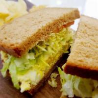 Egg Salad Sandwich · Egg Salad, Lettuce, Tomato and Mayo on Choice of Bread with the Choice of a Side.