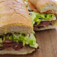 Hot Pastrami Sandwich · Hot Pastrami, Provolone Cheese, Lettuce, Tomato, and Mayo with Spicy Sauce on a French Roll ...