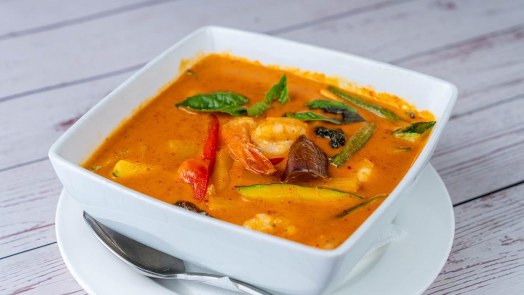 Red Curry · Spicy. Spicy red curry with coconut milk, string beans, eggplants, zucchini, bamboo shoots, bell peppers and basil leaves. Served with jasmine rice.