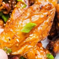 6 Pieces Of Wings With A Dip  · Choice of One flavor