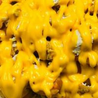 Kraken Fries (Loaded) · Crispy Fries loaded with melted cheddar cheese and topped with Shredded Chicken