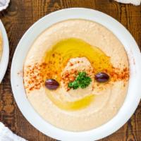 Hummus Dip · This middle eastern dip is a combination of garbanzo beans, sesame tahini, lemon, and garlic...