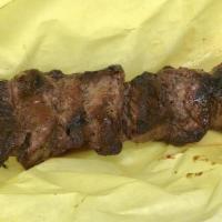 Ground Lamb Kabob · Two skewers of seasoned ground leg of lamb. Served with onions and tzatziki sauce.