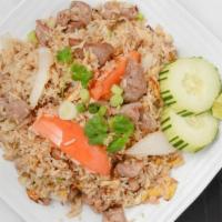 Thai Fried Rice · Choice of meat with egg, tomatoes, and onions.