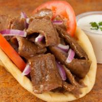 Gyros Sandwich · Served with onions, tomatoes and gyros sauce on the side.