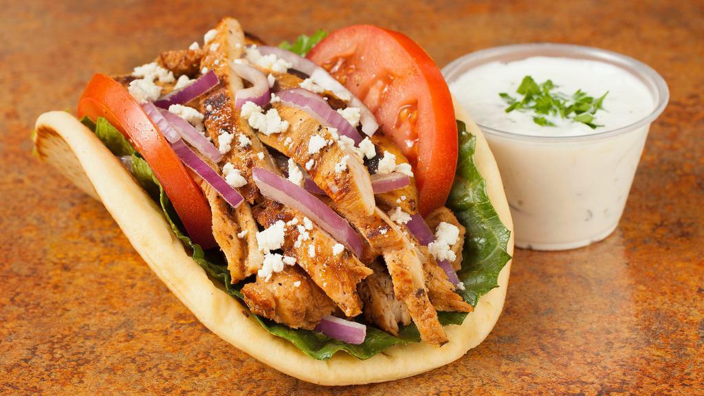 Chicken Pita Sandwich · Served with lettuce, tomatoes, onions, feta and gyros sauce on the side.