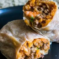 Surf & Turf Burrito · Asada, shrimp, French fries, Monterrey jack cheese and our special sauce.
