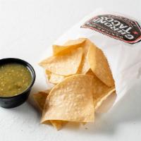 Chips And Salsa · Bag of chips and choice of freshly prepared mild Pico Salsa or Hot Red Sala or mild green sa...